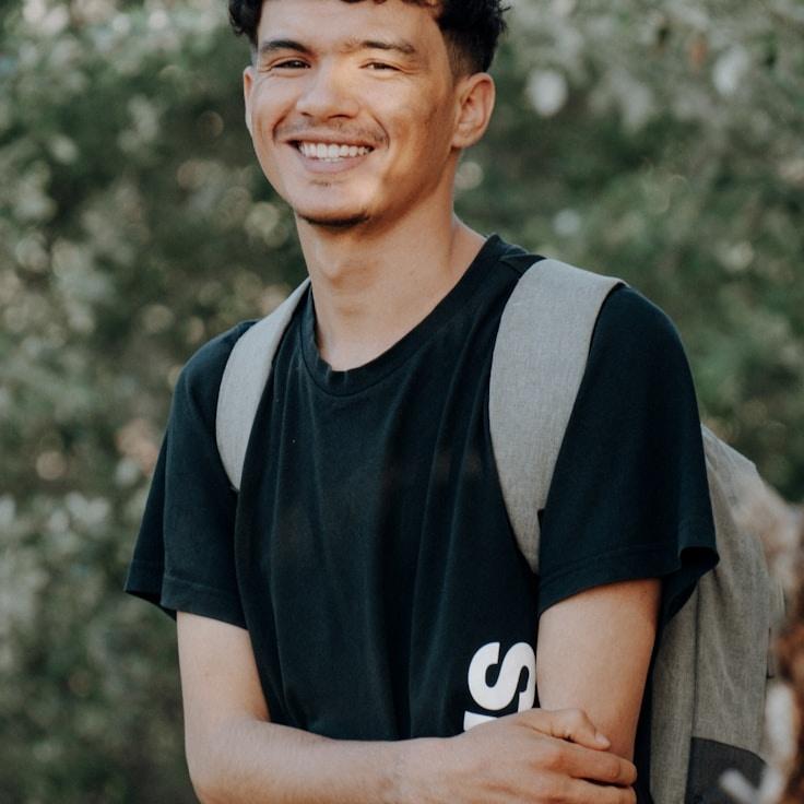 Kaveri Mehta, Lead Design Curator at Garden Paper Trail, reviewing corporate floral arrangements